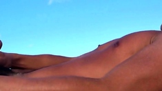 asian twink jerks off on beach