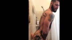 Tatted Hunk Fucks Dildo in Shower Until He Cums