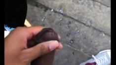 Two men cum together outside