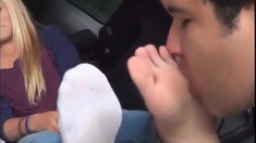 Feet licking in car...