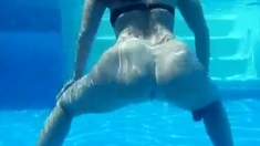 Curvy pawg strips and shakes her big booty underwater